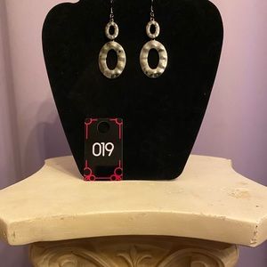 This silver colored double hooked earrings are great for day or night.